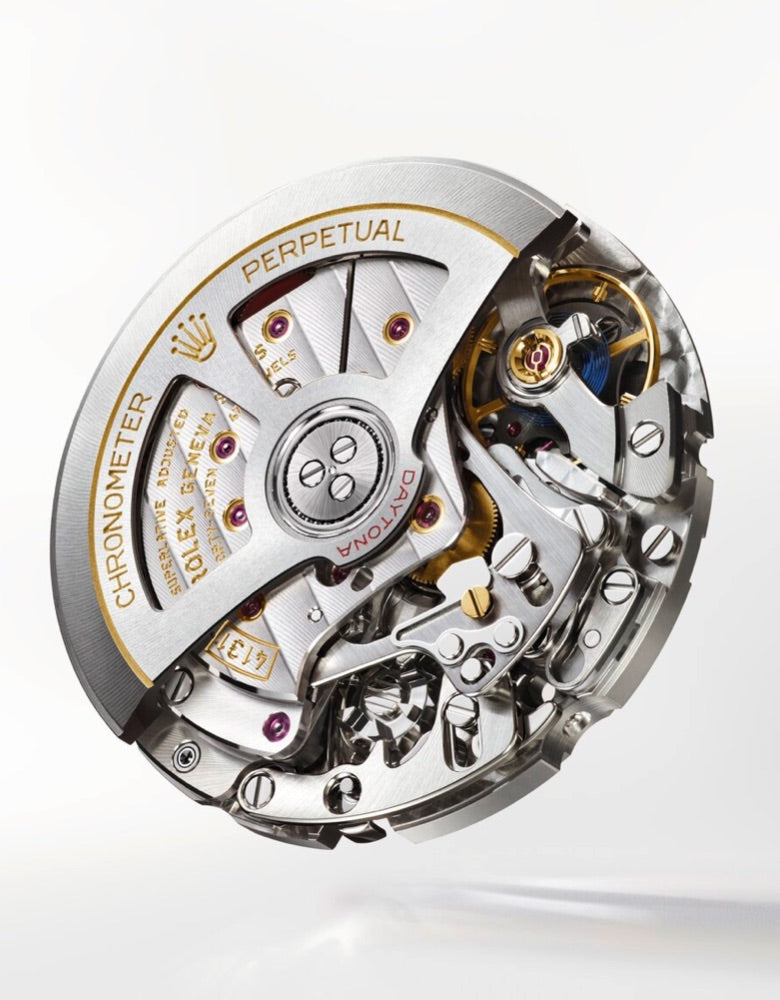 Close-up image of a sophisticated watch mechanism with intricate gears, components, and inscriptions 