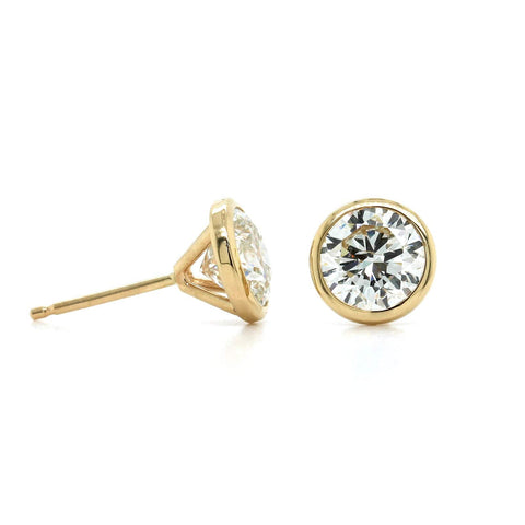 Contemporary Paisley Diamond Stud Earrings in White and Yellow Gold